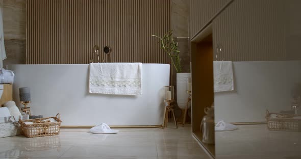 Bathroom Tiled with Marble Tiles in Different Shades of Brown