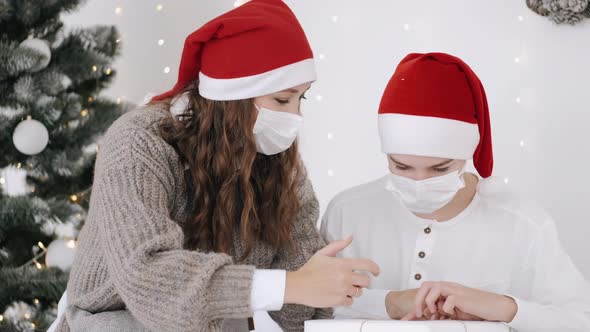 Mother and Son Unpacking New Year's Presents