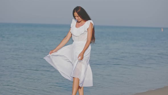 a Woman Walks Barefoot on the Sea