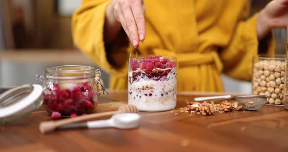 Woman Making Cereal Breakfast