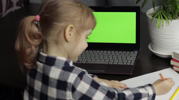 Girl Distance Education Lesson, Using Digital Laptop at Home. Green Screen