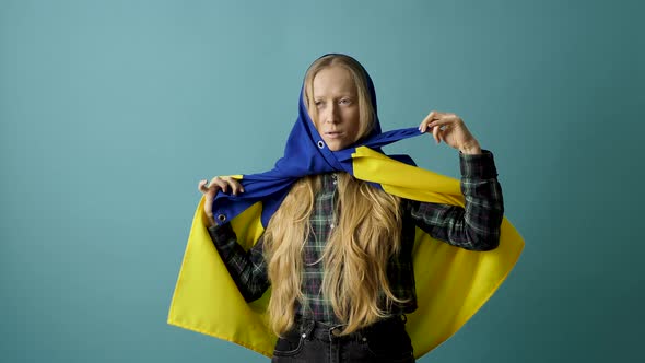 Young Woman with Ukrainian Flag on Head