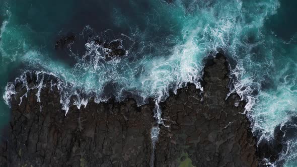 Ocean Waves Breaking on the Rocks on the Shore Aerial View