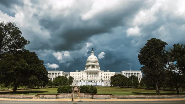 Stormy Clouds over the Capitol Building in Washington DC, cars and people walking by as clouds form