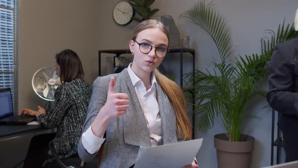 Female Business Company Manager Sitting at Office Desk Reading Resume Successful Job Interview