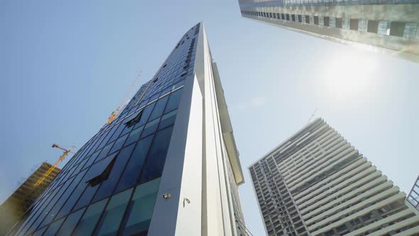 View of skyscrapers at low angle. Look into future. Bottom view