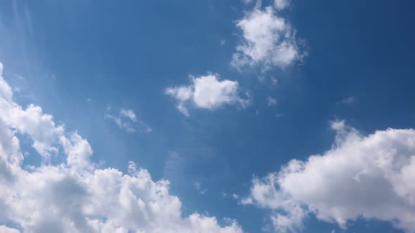 Timelapse summer clouds on blue sky alt