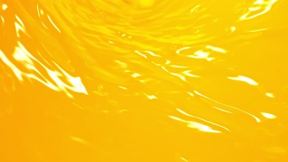 Super Slow Motion Shot of Fresh Orange Juice Wave at 1000 Fps