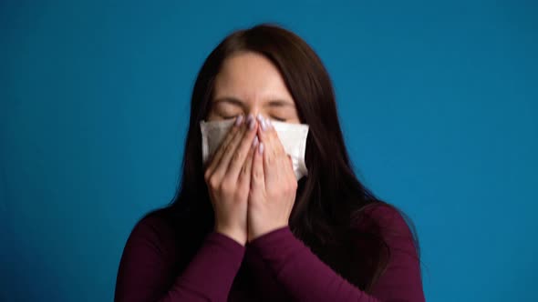 Woman Coughs Into Mask