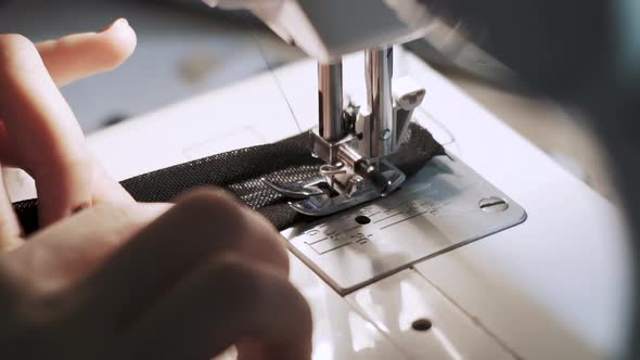 Close Up Shot of Female Hands Working on Sewing Machine