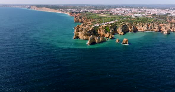 Aerial video from a partly cloudy day on the Algarve Coast, as the drone moving closer to the coast