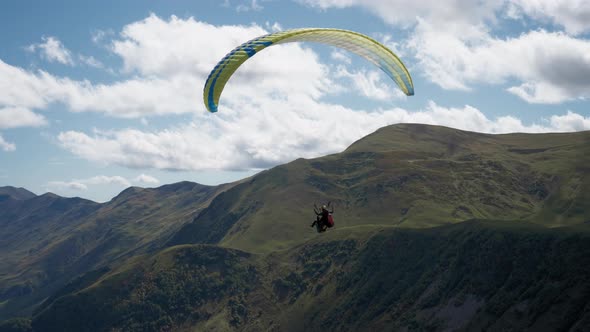 Parachute sky-diver in the mountains