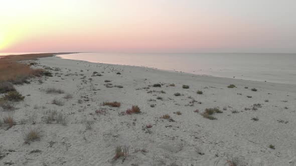 Sandy Beach and Sea at Sunset