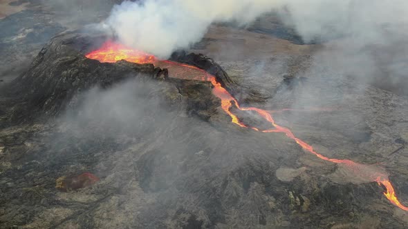 Drone view of Fagradalsfjall volcano crater filled with lava, Iceland