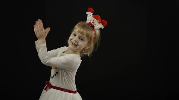 Happy Beautiful Baby Girl in Snowman Costume. Christmas. Make Faces, Dance