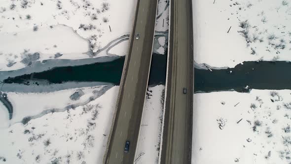 Winter Snow Transportation Over Frozen Blue River