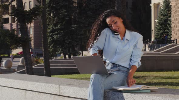 Multitasking Young Girl Business Woman Freelancer Study Working with Laptop Talking Mobile Phone