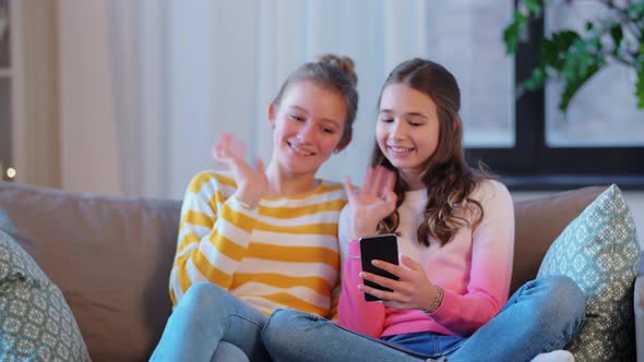 Teenage Girls with Smartphone Having Video Chat