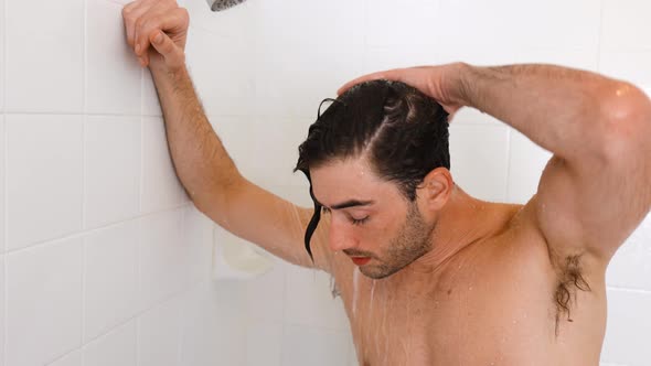 Athletic man taking his morning shower.