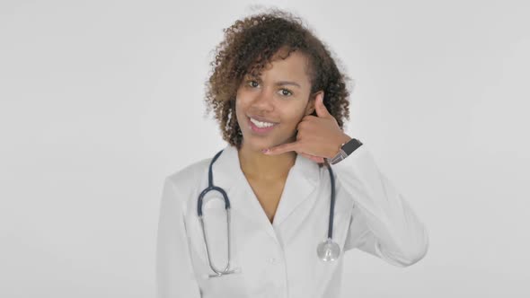 Call Me Gesture By African Female Doctor on White Background