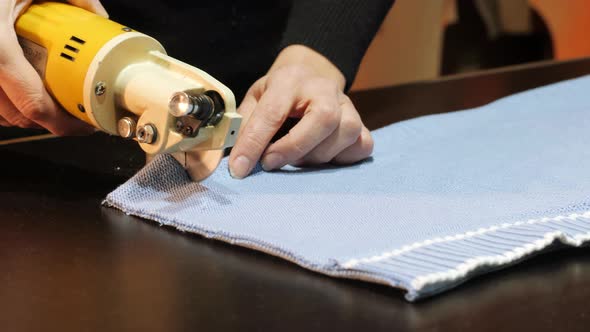 Female Hands Working on Electric Cutter