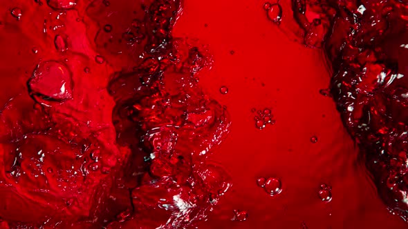 Super Slow Motion Shot of Rippling Fresh Red Wine Waves From Top Shot at 1000Fps.