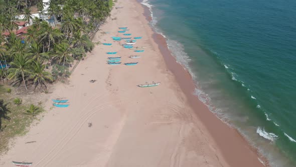 Kahanda Modara beach in Sri Lanka. Boats resting on the beach before fishing time.