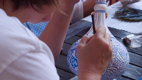 Turkish tile art. Turkish tile master painting.