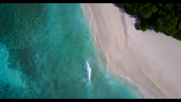 Aerial top view travel of paradise coast beach adventure by turquoise ocean with bright sand backgro