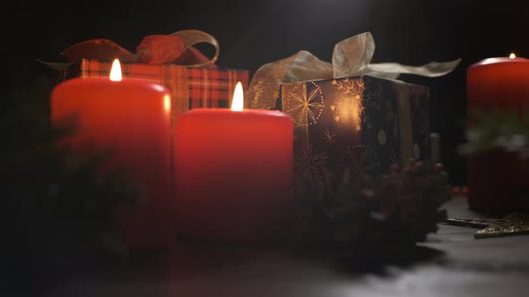 Christmas Decoration with Burning Candles on Dark Background. Christmas Holidays and New Year Theme.