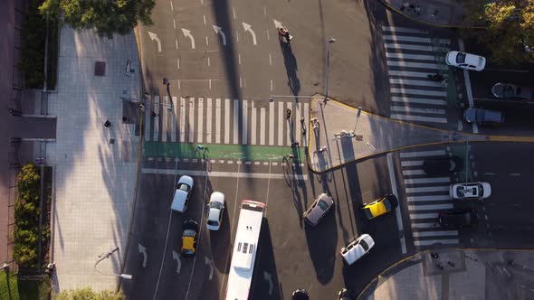 People walking on pedestrians crossing, Buenos Aires city in Argentina. Aerial drone directly above