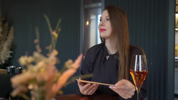 Young Woman in a Restaurant