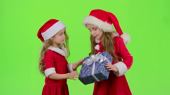 Baby Gives a New Year Gift To Her Friend. Green Screen. Slow Motion