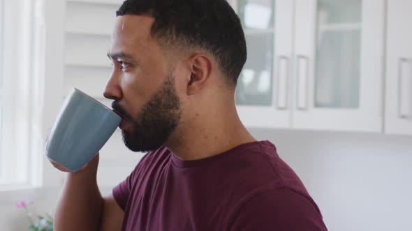 Man drinking coffee at home