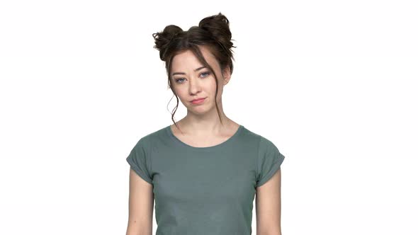 Portrait of Bored Woman 20s with Double Buns Hairstyle Shaking Head and Rolling Her Eyes in