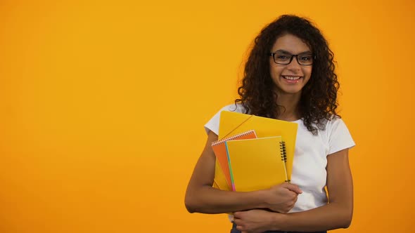 Afro-American Girl Standing With Books, International Student Exchange Programs