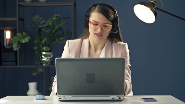 Business Woman Works Late at Night in the Office