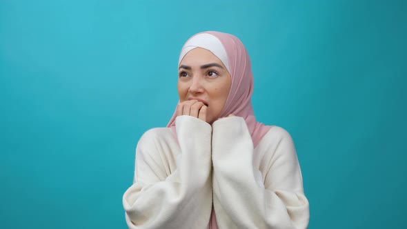 Insecure Frightened Young Muslim Woman in Hijab Biting Nails Feeling Worried Nervous About Serious