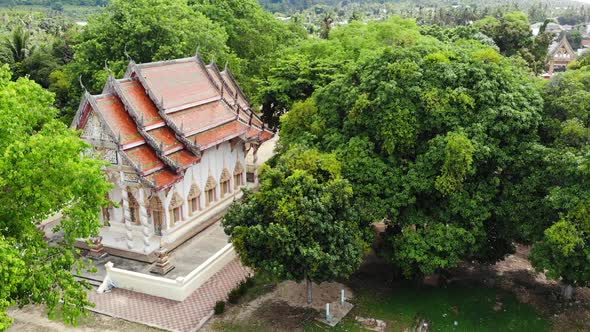 Classic Buddhist Temple Between Forest. From Above Drone View Buddhist Monastery Between Green Trees