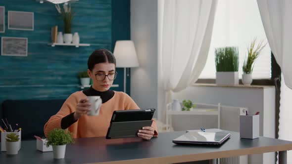 School Student Using Digital Tablet to Work on Class Assignment alt