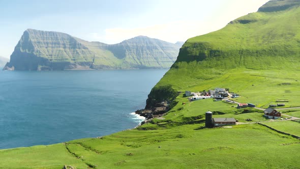 Faroese Nature Green Hills and Mountains with Small City Trollanes in Kalsoy