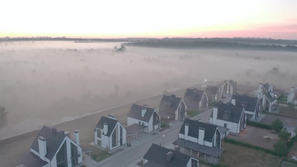 Townhouse at Dawn with Fog That Hangs in Layers. Light Haze. Oak Forest, Field