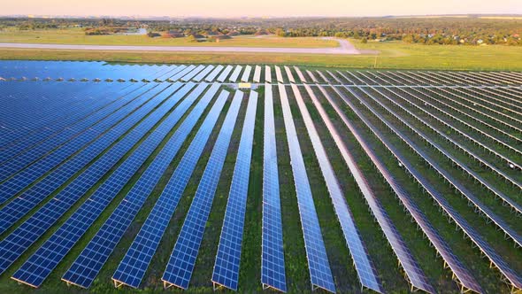 Aerial View of Large Solar Panels at a Solar Farm at Bright Summer Sunset, Solar Cell Power Plants