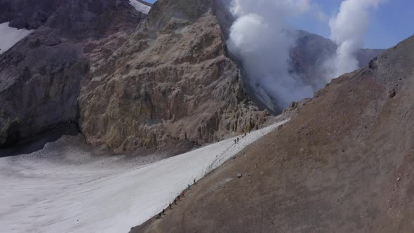 Aerial Drone Footage of Mutnovsky Volcano Crater with Fumaroles and Glacier