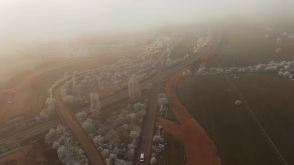 Aerial Footage Frozen Trees, Fog Above The Road