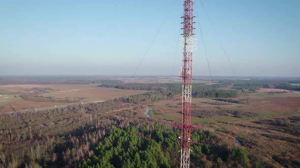 Telecommunications Tower on the Background of the Blue Sky in the Countryside