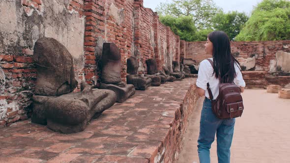 Japanese backpacker female enjoy her journey at amazing landmark in traditional city.