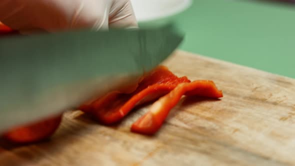 Chef Cut Bell Pepper On Wooden Board With Zucchini