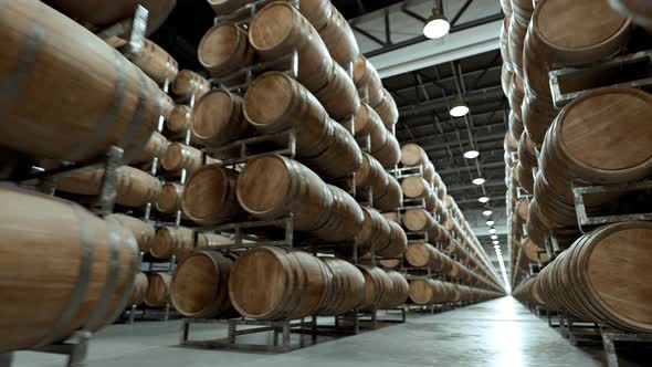 Alcohol storage. Old whiskey or wine barrels stacked in rows at the warehouse.