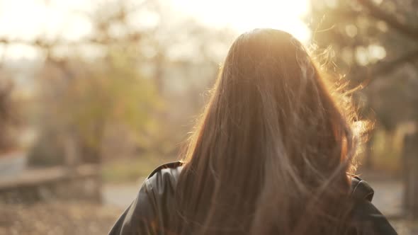 Young Woman Smiles and Calls to Her